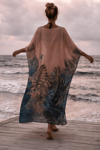 Luxury black panther kaftan worn at the beach, lightweight resort wear and beach cover-up