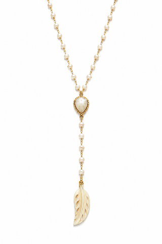 A delicate gold and pearl necklace featuring a heart-shaped pearl pendant, a beaded drop chain, and a carved ivory leaf pendant, shown on a plain white background.