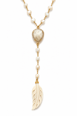 A gold and pearl dangle necklace featuring a heart-shaped pearl centerpiece, a feather-shaped ivory bone pendant, and small pearl beads on a white background.