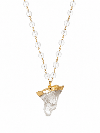 Natural crystal quartz statement necklace with gold wirework on white background