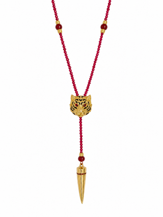 A red beaded necklace with a gold tiger head pendant and a gold spike pendant, shown on a plain white background.