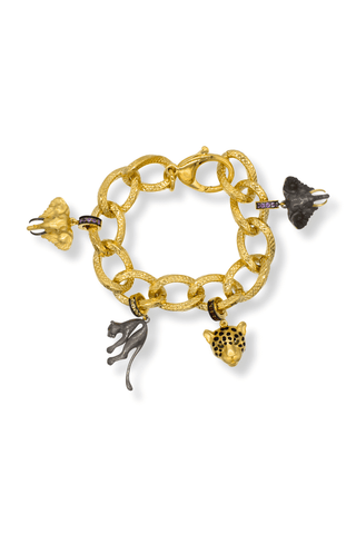 Gold elephant charm gemstone-set clasp close-up

